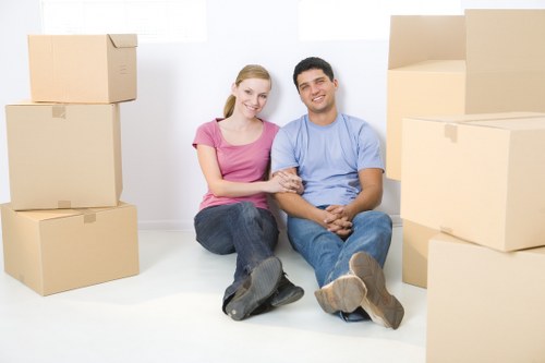 Packed moving boxes and furniture ready for loading into a removal van