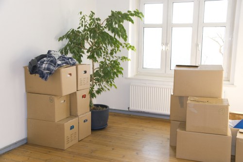 Professional movers transporting office furniture in South London