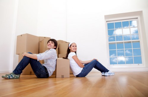 Removal staff handling office furniture for a commercial move near Crystal Palace