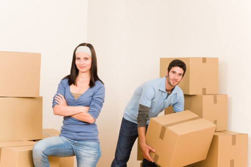 Local removals team handling furniture in a Crystal Palace property